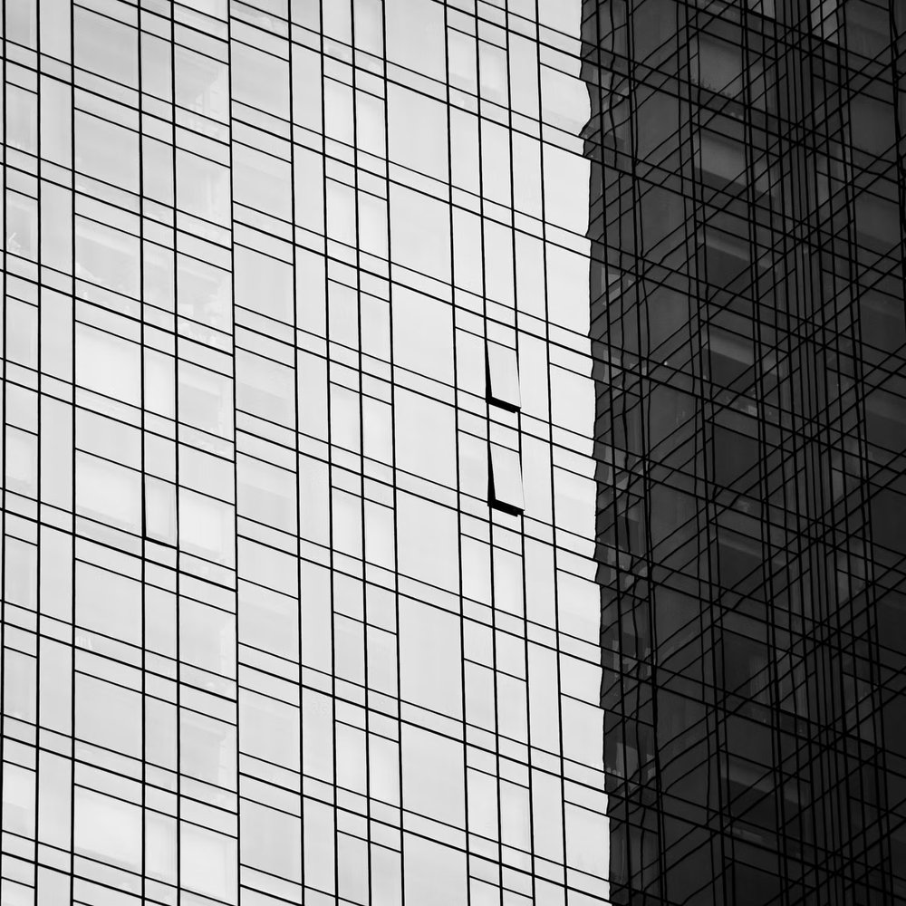 Modern building facade with several outward-opening windows