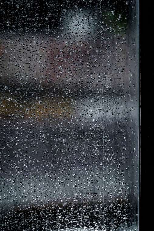 Raindrops on window glass during wet weather