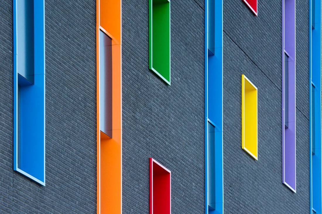 Modern façade with colourful framed windows
