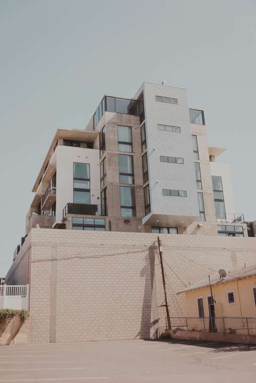 Contemporary residential building with glass windows and balconies