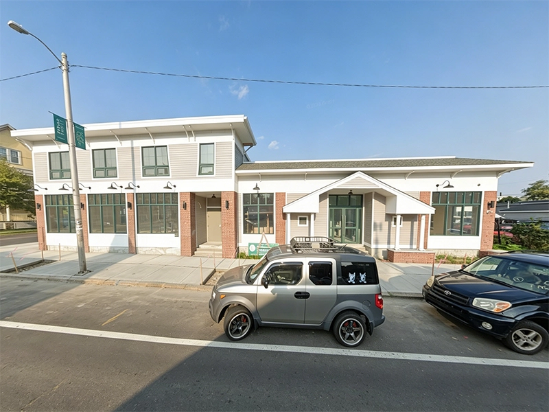 Completed commercial building with large black-framed glazing