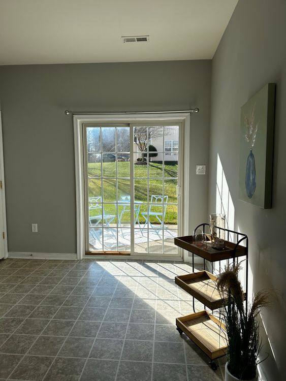 Bright living room with a wide glazed opening to a lawn
