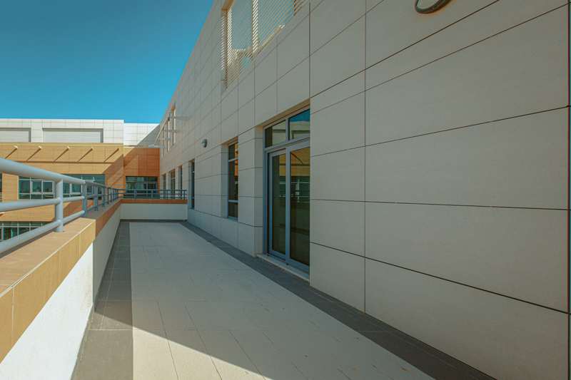 Exterior balcony with a large sliding glass door