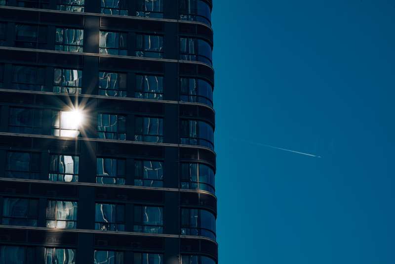Sunlight reflecting from windows on a modern building