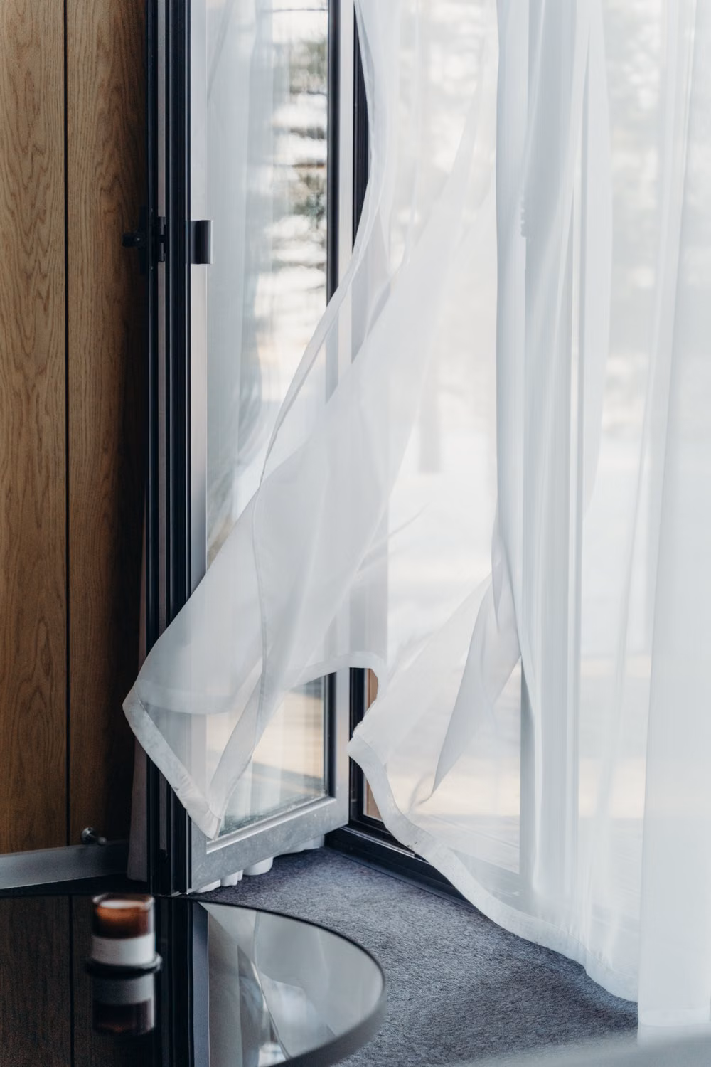 Wind Whistling Through Windows? 7 Causes and Fixes