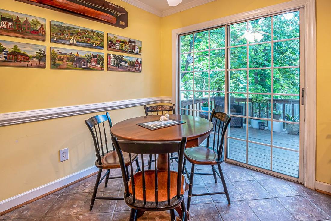 Dining room beside a glazed sliding door opening to a balcony