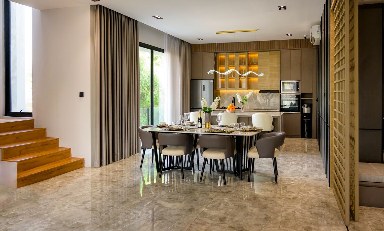 Modern dining area next to glazed doors in a residence