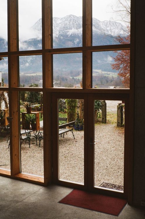 Wide glazed doors overlooking a mountain landscape