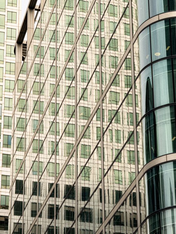 Close view of a geometric reflective skyscraper façade