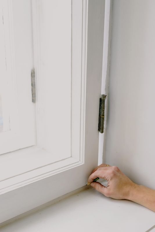 Installer measuring a window sill
