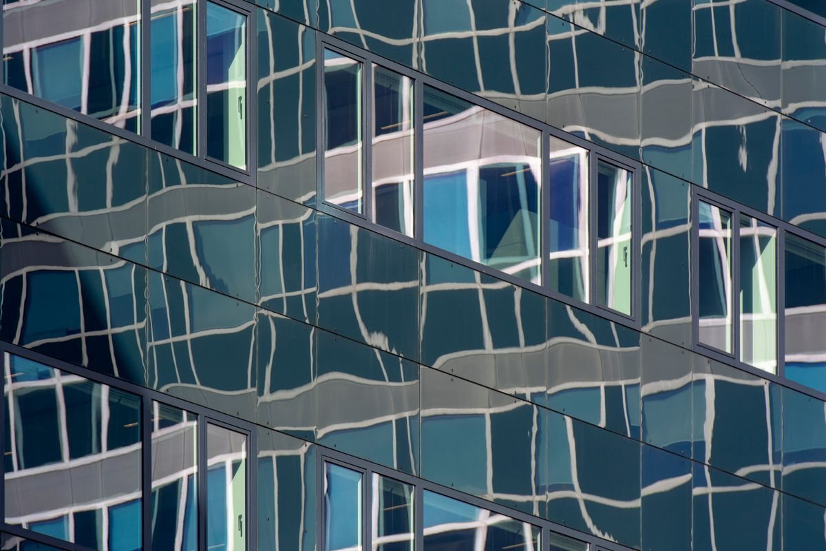 Modern glass facade with reflections