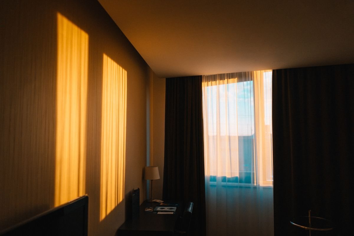 Hotel room window with curtains