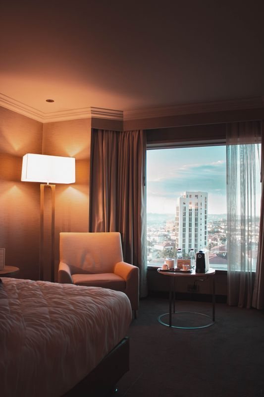 Hotel room with city-view window