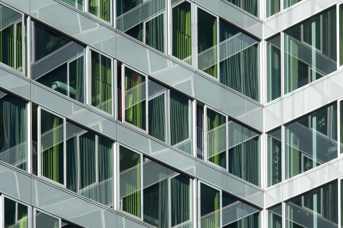 Close view of geometric facade panels and windows