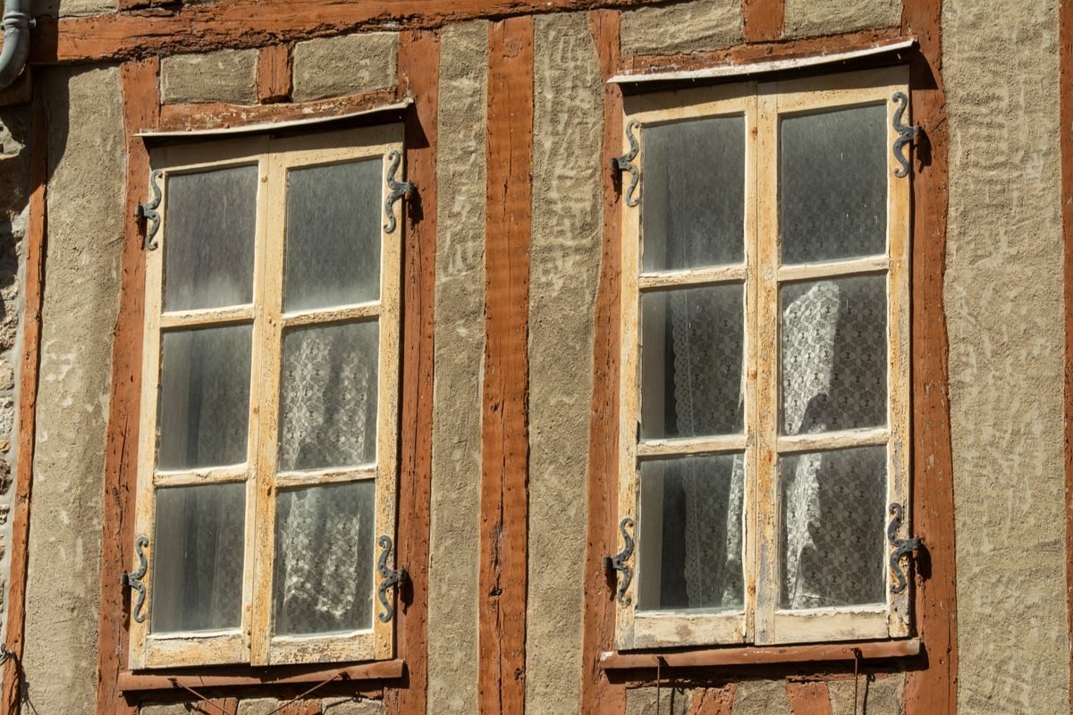 Two traditional opening windows on a facade
