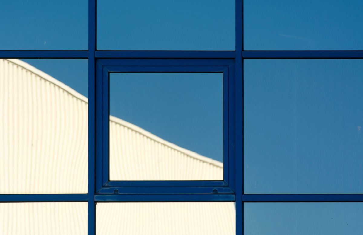 Blue-tinted reflective glass window facade