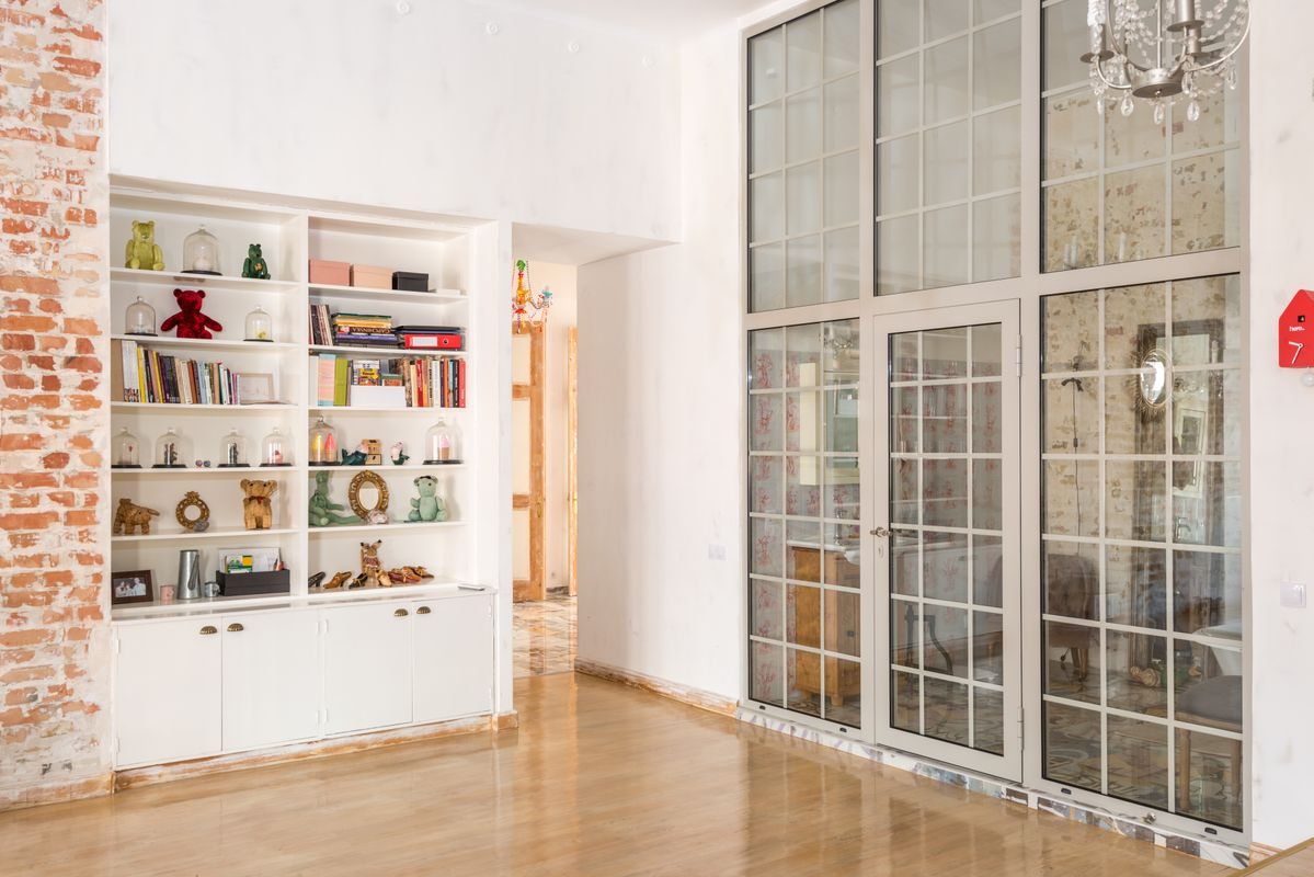 Floor-to-ceiling glass doors in a modern interior