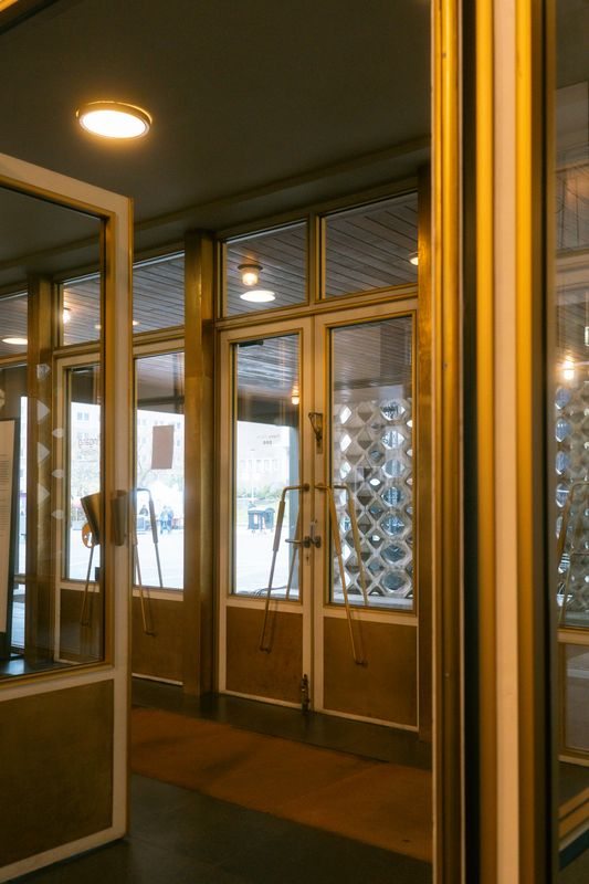 Reflective glass doorway in a commercial interior