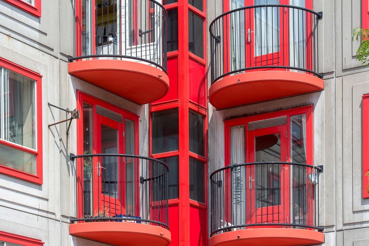 Residential facade with projecting balconies and windows