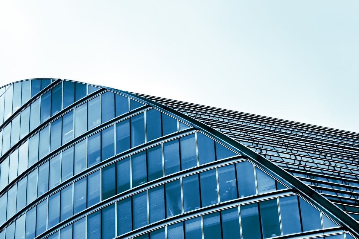 Urban building with a sweeping curved glass facade