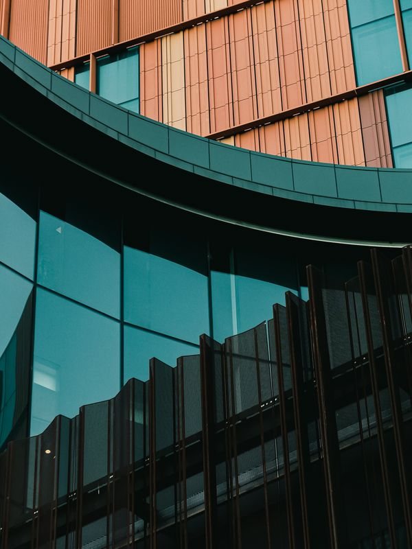 Close view of glass and metal facade geometry