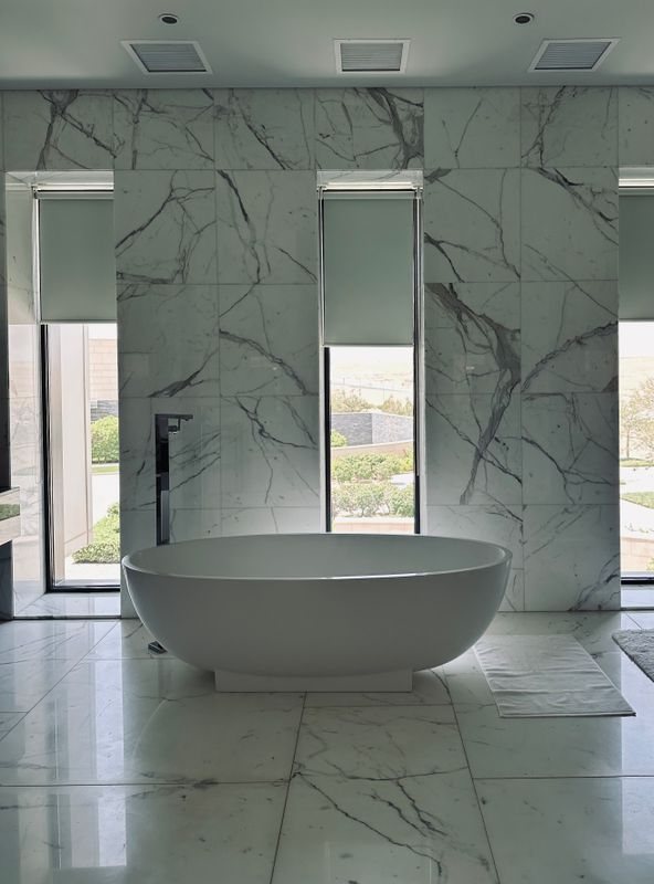 Modern marble bathroom with controlled daylight